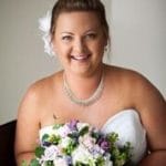 Girl Smiling and wearing wedding dress - hair services in Avoca, QLD